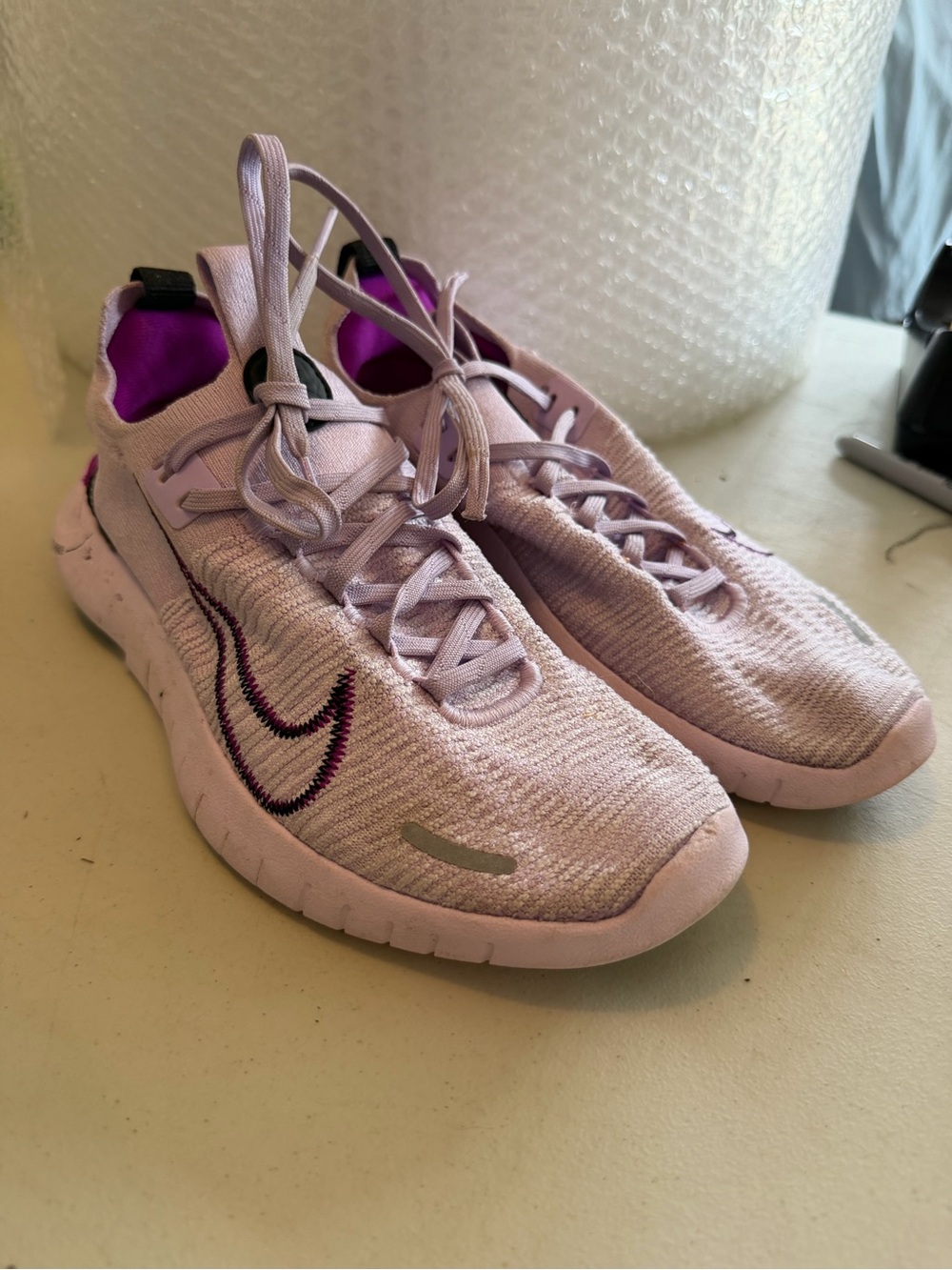 Nike Women's Lilac Knit Running Sneakers size 7 dog teeth marks